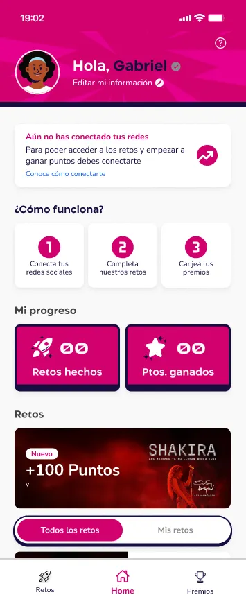 Home screen with a magenta header, a three-step explainer, progress counters for challenges and points, and a Shakira challenge banner.